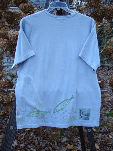 1999 Short Sleeved Tee Fish Triple Water Size 1: A blue t-shirt with fish drawn on it, featuring a slightly rolled ribbed neckline and a straighter shape. Made from medium weight organic cotton jersey.