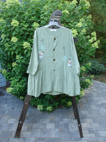 1998 Botanicals Meadow Jacket Palm Tree Elm Size 1: A green shirt with ceramic buttons and a flounce, featuring a botanicals theme paint.