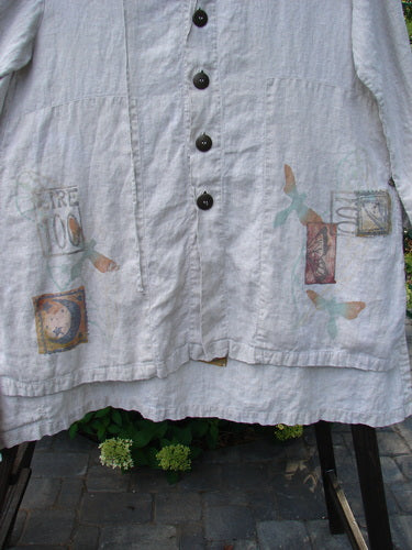 1998 Traveler's Jacket with celestial travel theme, corded linen hoodie, button front, vented sides, and deep pockets.