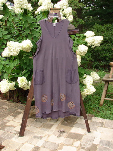 2000 Thermal Lannean Jumper with ric rack detailing, size 0. A purple dress on a clothes rack, featuring a longer bell shape and flannel front pockets.