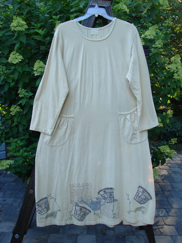 1999 Tea Time Dress: white dress with a design, hourglass shape, wider hip and hemline, front pockets, fancy flower pot theme paint, softly rolled neckline, draw cord back, signature Blue Fish patch, S-cured vertical seams. Bust 54, Waist 56, Hips 58, Sweep 70, Length 52.