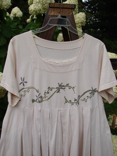 1993 Boxcar Dress with floral vine design on white fabric.