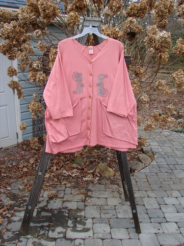 1994 Treasure Jacket Wind Spin Altered Coral OSFA: Pink jacket with V-shaped neckline, drop shoulder seams, and front flop pockets with button closure.