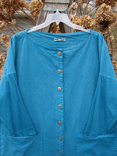 Aqua Barclay Cotton Sleeve Hemp Jacket, Size 2. Full metal button front, boatneck, oversized painted pockets. Straight shape, slim organic cotton sleeves. Bust 62, waist 62, hips 62, length 33.