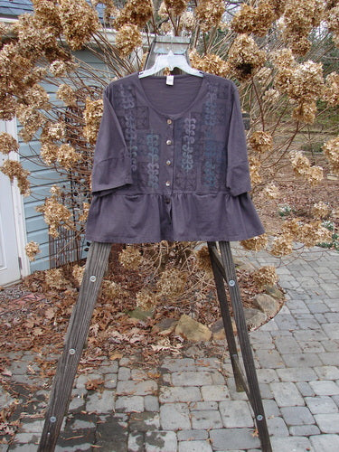 Image alt text: Barclay Peplum Pocket Jacket in Brum, size 2, on a wooden stand.