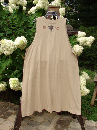 1996 State Fair Vest: A white dress on a clothes rack. Features include a single oversized button, double paneled hemline, and wide A-line shape. Bust 54, Waist 60, Hips 72.