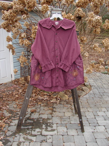 2000 Flannel Poet's Top Spin City Murple Size 2: A uniquely styled jester's collar, rounded vented hemline, and mix-matched pull cord lower sleeves. Two oversized angled front pockets and tons of tiny original buttons. Sectional gather rear bodice seam.