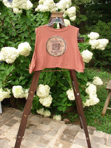1994 Spruance Vest with medallion rose design on a shirt rack.
