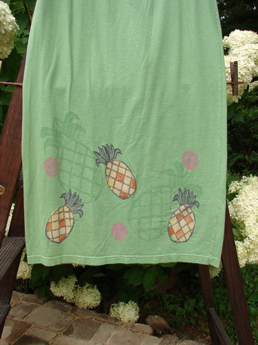 1999 Straight Skirt Pineapple Spearmint Size 0: A green towel with pineapples on it, perfect for summer.