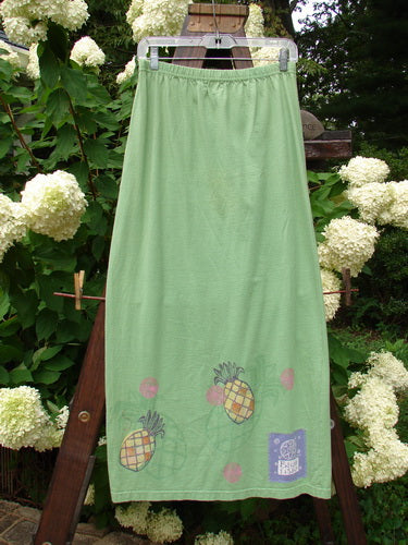 1999 Straight Skirt Pineapple Spearmint Size 0: A skirt with a pineapple theme paint design on the hemline, made from organic cotton.