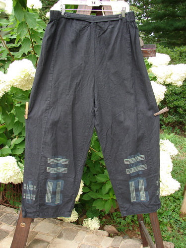 Image alt text: "2000 Waveline Pant Grid Block Black Size 2: A pair of pants on a clothesline, made from light weight hemp, with a unique flat button front waistline and a generous hip measurement. Slight crop length, supreme big block grid theme paint, and a nice drape."