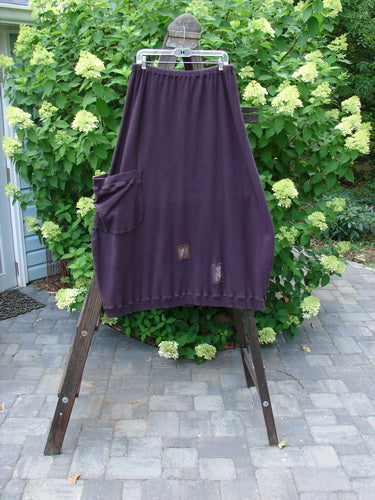 Barclay Patched Thermal Side Pocket Skirt Dream Red Plum Size 2: A skirt with vertical panels, a ribbed hemline, and an oversized bottom side pocket. Made from cotton thermal rib, it offers a wide shape and a full elastic waistline. Waist: 28-48, Hips: 54, Length: 40 inches.