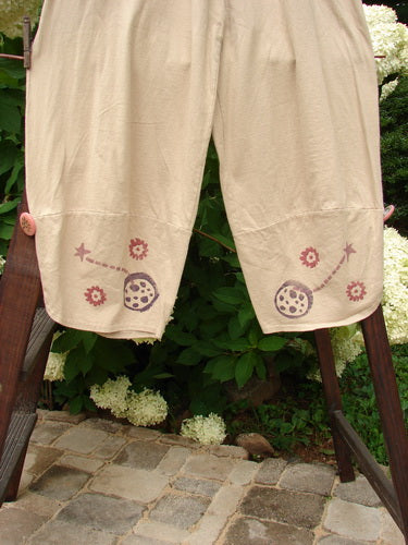Image alt text: "1996 Boulevard Pant Star Travel Dune Size 1: Organic cotton pants with a star travel theme paint design, elastic waistline, side seam pockets, and overlapping painted cuffs."