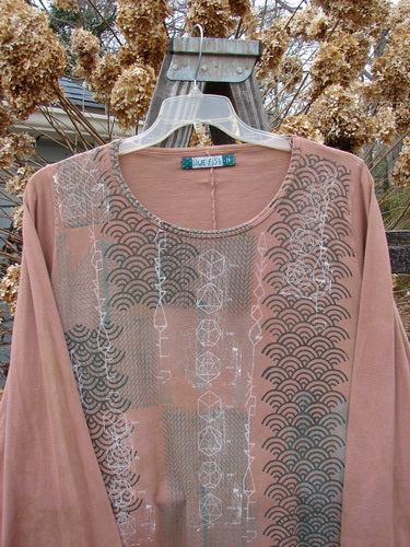 A Barclay Long Sleeved A Lined Tee Top featuring a metallic continuous grid pattern on mottled carmel fabric. The top has a rounded neckline, cozy long sleeves, and sweet curled edgings. Size 2.