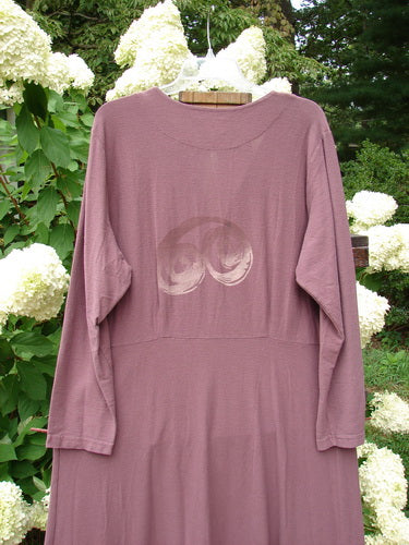 2000 Crepe Tara Dress Celtic Loam Size 1: a long sleeved purple shirt with a logo on it, perfect condition, elegant and slenderizing piece, four tiny pewter buttons, darted bodice and empire waist, back vertical drawcord sweeping hemline, continuous Celtic theme paint, long flowing drape.