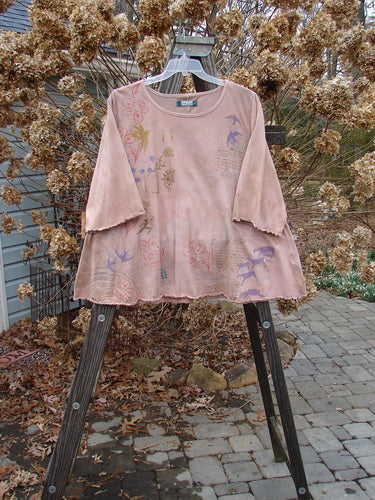 Image alt text: Barclay Three Quarter Sleeved Crop A Lined Tee Top with Love Dove design, mottled mauve. Graduating A-line shape, rounded and rolled neckline, sweet curly edgings.