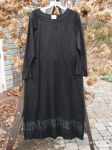 Image Alt Text: "2000 Ringlet Dress in Black, featuring serious sectional panels, oversized pockets, V-shaped neckline, and a super widening shape. Made from thicker weighted linen. Bust 50, Waist 50, Hips 52, Length 55 inches."

Note: The alt text focuses on describing the visual details of the product image, incorporating relevant information from the product description, and aligning with the product title. It does not include store information.