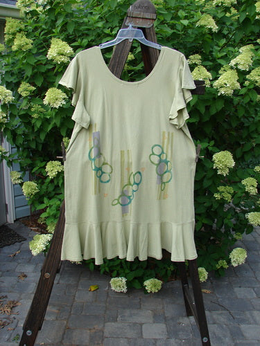 1996 Butterfly Dress Pebble Path Seedling Size 2: A dress on a rack with ruffled sleeves, a rounded neckline, and a pebble path theme paint. Bust 48, Waist 50, Hips 52, Length 36.