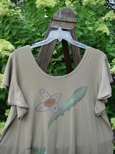 1996 Butterfly Dress with Feather Flower Paint on a swinger, made from Light Weight Organic Cotton. Short ruffled sleeves, coordinating ruffled hem flounce, deep rounded neckline. Bust 48, waist 50, hips 52, flounce 80, length 36.