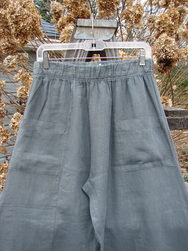 Image alt text: Barclay Linen Crop Side Pocket Pant on a swinger, a light blue linen pant with elastic waistline, billowing fall, and front pockets. Size 0.