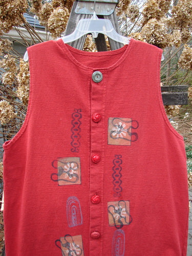 1996 Symbol Vest Gateway Pomegranate Size 1: A red vest with designs on it, featuring a slightly shallow neckline, vintage oversized button, knotted and textured chunky buttons, not too deep arm openings, tiny vented sides, and a straighter shape.