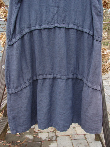 Barclay Linen Three Length Snap Dress Unpainted Blue Raven Size 1: A versatile blue skirt with a ruffled design, perfect for mixing and matching lengths. Features a rounded neckline, straight shape, and two front pockets.