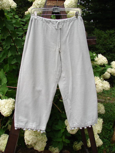 1999 PJ Pant Pom Pom Unpainted Solstice Blue Size 0: Heavyweight flannel pants on a clothesline with pom poms on each cuff.
