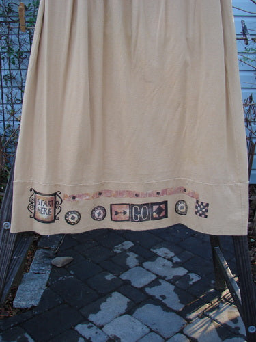 Image alt text: 1998 Scrabble Skirt with games theme pattern, waistline with elastic, horizontal panels, finger pockets, and lower weighted swing. Size 2.