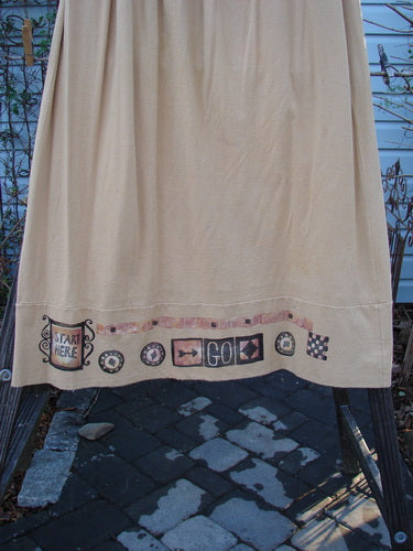 1998 Scrabble Skirt Games Bamboo Size 2: A skirt on a clothesline, featuring a waistline with folded front and rear elastic, horizontal panels, a lower banded wider sweep, and upper finger pockets.