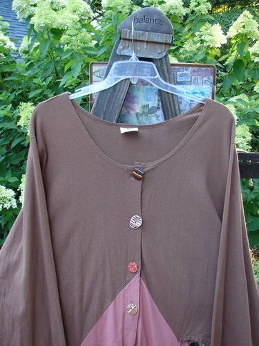 A Barclay Calligrapher's Jacket in Brown and Mauve, size 2, made from Organic Cotton. Features include a unique shape, long dippy sides, open hips, and a deep V neckline. Unpainted with a striking two-tone contrast. Bust 56, waist 60, hips 70, open rear length 35, side lengths 56.