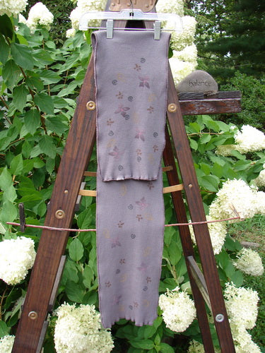 Barclay Thermal Double Layered Scarf with Tiny Floral Pattern, Light Plum. Sweet curly edges, waffle texture, fully stitched finish. Giant lower floral accent with tiny flowers. Slight stretch, cozy. Measures 8" wide and 52" long.