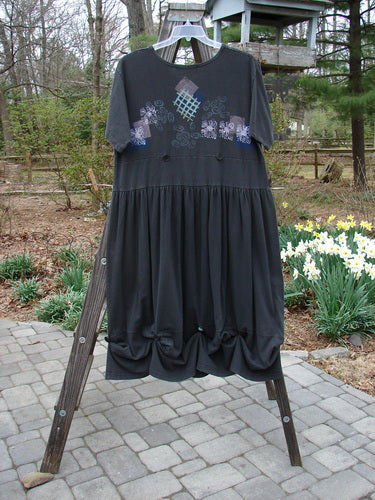 1996 Constellation Dress Garden Path Storm Size 2: A dress on a rack with a black design, adjustable hemline, and a painted pocket.