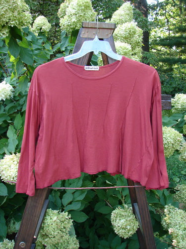 Barclay Batiste Pinch Crop Top Unpainted Autumn Size 1: A red shirt with interesting vertical pinch accents, three-quarter length sleeves, and a widening lower hem. Made from featherweight cotton batiste.