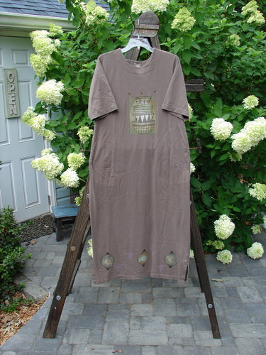 1999 Straight Dress Nesting Bowls Riverbed Size 1: Brown shirt on wooden rack, t-shirt with picture, t-shirt on swinger, brown cloth from ladder, white flowers on white door.