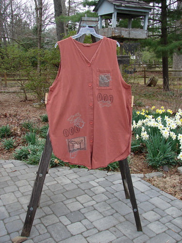 1995 Breeze Vest Space Odyssey Russet OSFA: A red shirt on a rack, close-up of a vest, vest on a stand, red shirt on a wooden ladder, close-up of a flower bed, roof of a building.