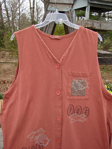 1995 Breeze Vest Space Odyssey Russet OSFA: A close-up of a shirt on a swinger. Features include a rounded front and back shirttail hemline, deep V-shaped neckline, and tall rounded vented sides. The vest has a front painted breast pocket, sweet tabbed upper rear, and super back drop gathers. Made from organic cotton, it showcases the original Blue Fish recycled paper buttons.