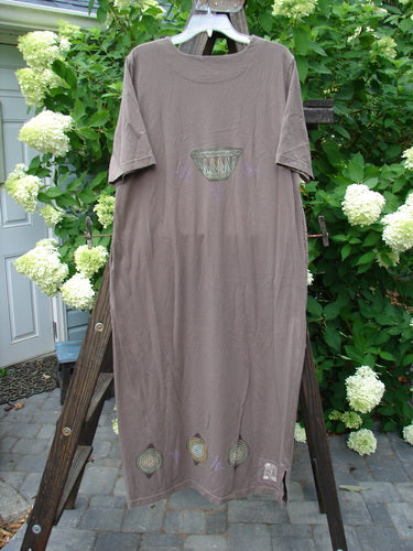 1999 Straight Dress Nesting Bowls Riverbed Size 1: Long dress on a rack, made from organic cotton. Rounded neckline, side entry pockets, widening hips, vented hemline. Bust 44, waist 44, hips 46, length 50 inches.