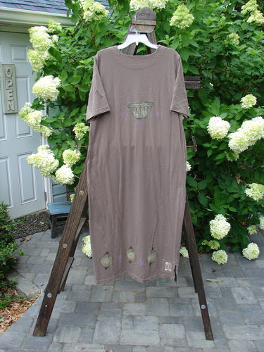 1999 Straight Dress Nesting Bowls Riverbed Size 1: A straight dress made from organic cotton. Features include rounded side entry pockets, paneled neckline, widening hips, and a vented hemline. Length: 50 inches.