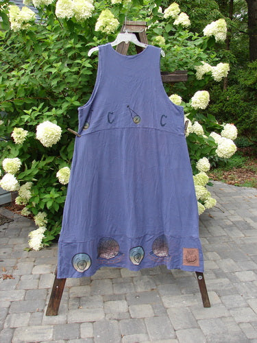 Image alt text: "1998 Azoth Vest Mystic Continuous Earth Orion OSFA - Blue dress with design on rack, featuring double paneled bodice, banded hemline, vintage button, and sweeping hemline. Two oversized side pockets. Bust 52, Waist 52, Hips 64, Length 53 inches."