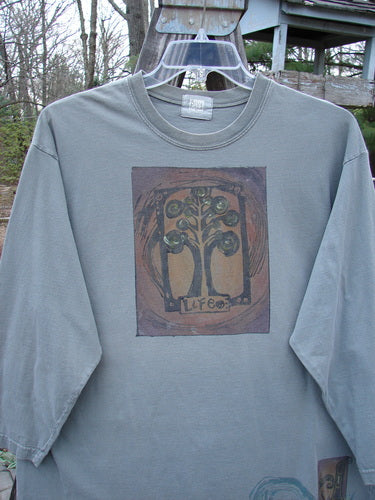 2000 Long Sleeved Tee Tree of Life Park Size 1: A long sleeved shirt with a colorful tree of life painted on it.