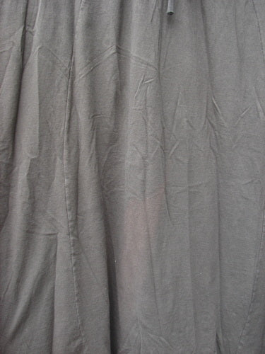 1994 Scroll Jumper Wind Edo Black OSFA: A close-up of a grey fabric curtain, part of the Fall Collection.
