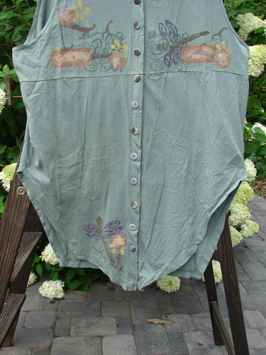 1994 Cricket Vest Dragonfly Garden Seaweed Size 2: A shirt on a rack with a green dragonfly design. Perfect condition, medium weight cotton.