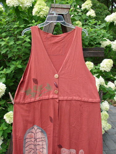 1993 Little Tree Vest Falling Leaf Red Oro OSFA: A red dress on a swinger, with a close-up of the dress. Features include a unique snap-on lower panel, vintage buttons, and a deep V neckline. Perfect condition, mid-weight cotton.