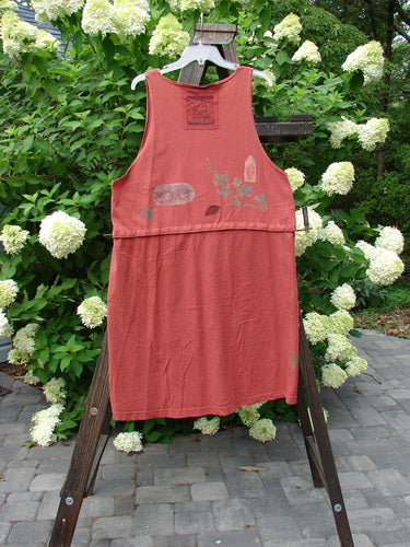 1993 Little Tree Vest Falling Leaf Red Oro OSFA: A red dress on a rack, featuring a unique snap-on lower panel for a crop vest look. Shimmering harvest theme paint, vintage buttons, and a deep V neckline. Bust 44, waist 46, hips 48, length 40 inches snapped, 18 inches unsnapped.