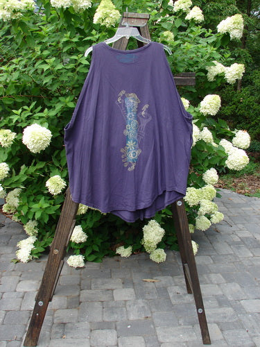 1994 Sleeveless Vest Celestial Blueberry Size 1: A purple shirt on a wooden stand with a celestial theme paint.