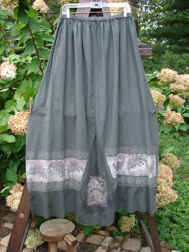 Barclay Linen Duet Skirt Green Raven Size 2, featuring a floral design, full elastic waistline, bell shape, sectional panels, V-shaped insert, varying hemline, and cotton lower flutter.