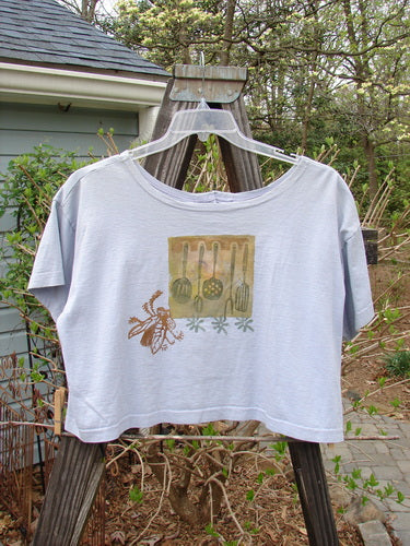 1994 Song Top Vintage Kitchen Garden Lavender Size 1: T-shirt on a swinger with wide boxy shape, shallow neckline, painted breast pocket, and Blue Fish patch.