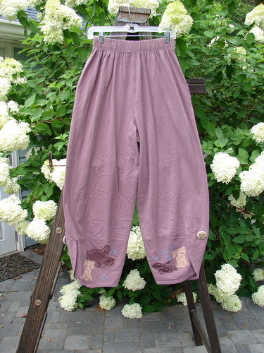 1996 Boulevard Pant Old Car Travel Laurel Size 1: A pair of pants on a rack, featuring a two-inch elastic waistline, side seam pockets, and painted cloth covered buttons.