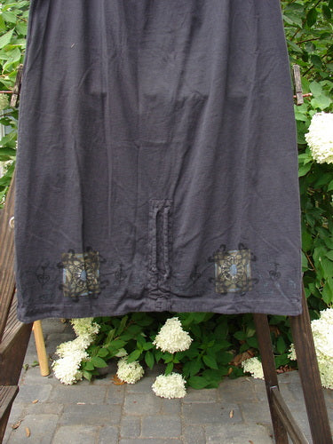 1999 Winter Skirt Celtic Five Raven Size 2: A black skirt on a rack, featuring a lower peg shape and Celtic Five theme paint.