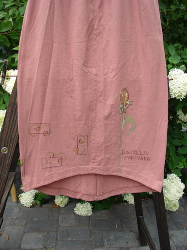 1998 Botanicals Corolla Skirt Digitalis Magnolia Size 1: A slenderizing pink skirt with a full elastic waistband and a scooped front hemline featuring the Botanicals Digitalis theme.